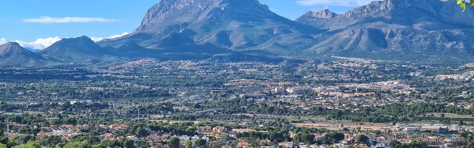 The Puig Campana mountain rising above towns and pine woods on the Costa Blanca